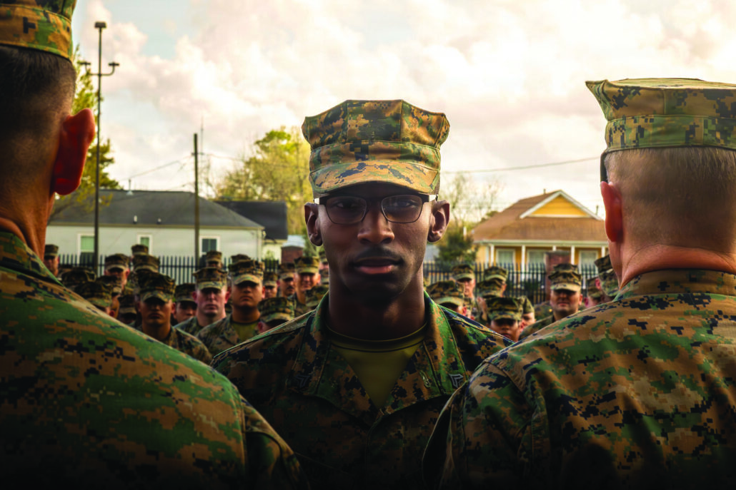 US Marine standing in front of a group of reserve marines. 